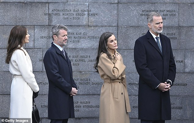 The royals exuded glamour, as did Letizia in a long coat with a belt, which accentuated her long, lean body