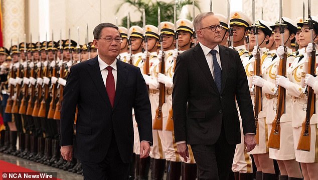 Mr Albanese (right) was ceremonially welcomed by Chinese Premier Li Qiang (left) at the Great Hall of the People in Beijing