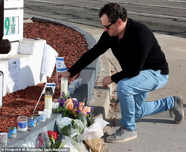 Mourners visit the site where Paul Kessler was killed during a duel between Israel and Palestine at the intersection of Thousand Oaks Boulevard and Westlake Road in Thousand Oaks, California