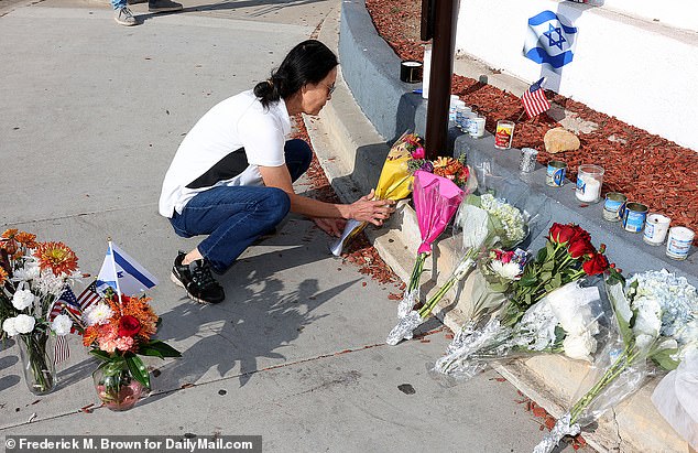 Mourners visit the site where Paul Kessler was killed during a duel between Israel and Palestine at the intersection of Thousand Oaks Boulevard and Westlake Road in Thousand Oaks, California on November 7, 2023