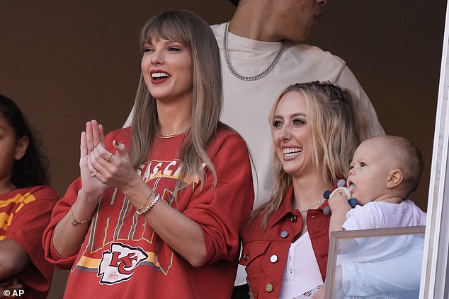 Taylor Swift cheers next to Brittany Mahomes, right, before the start of an NFL football game between the Kansas City Chiefs and the Los Angeles Chargers Sunday, Oct. 22, 2023