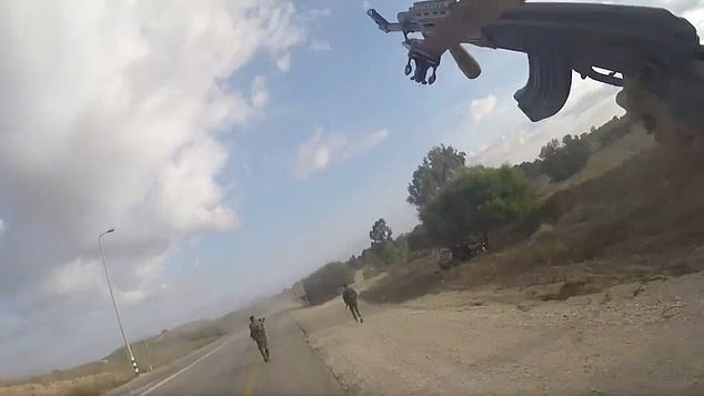 The video shows Hamas attackers running along Highway 232 on October 7