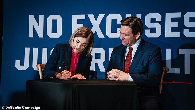 Reynolds signs her caucus commitment to the DeSantis ticket and he has more than 20,000 Iowans committed to him so far