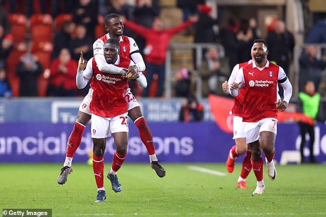 Christ Tiehi of Rotherham United celebrates his equalizer in the 92nd minute at the end of the match