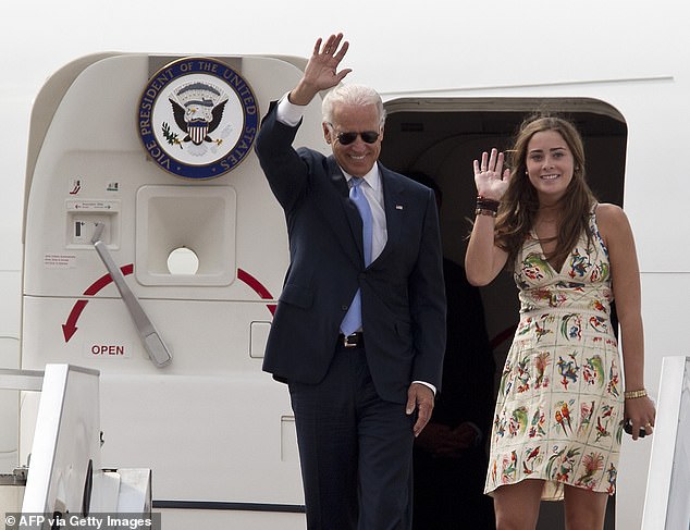 Naomi Biden, seen back in 2011 when her father was Biden's vice president, took on Axelrod after a new poll showed her grandfather, 80, trailing Donald Trump in five of six critical swing states