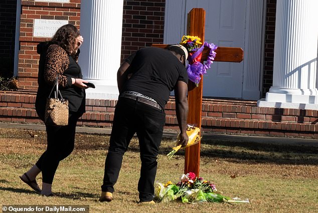 Several bouquets and a wreath of flowers were left in memory of Fred L. 