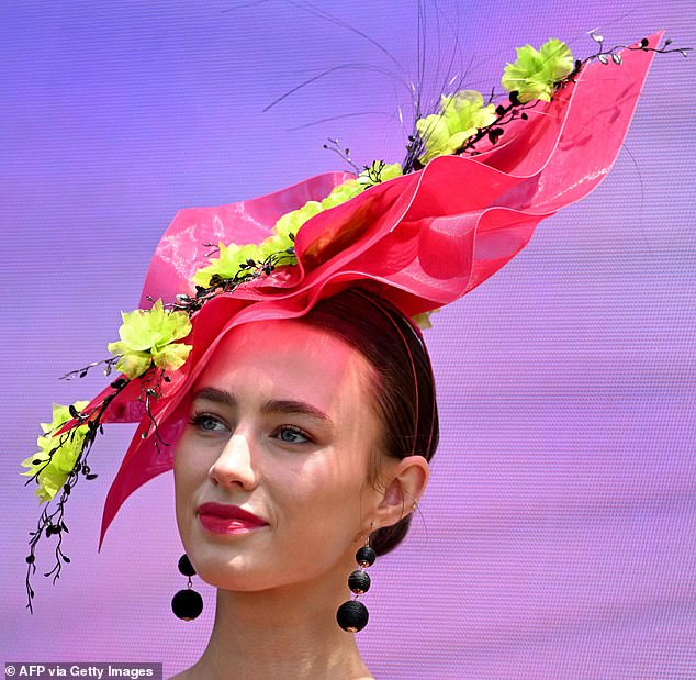 Cynthia Jones-Bryson Millinery took first place in Fashion on the Field's Lillian Frank Millinery Award with a neon green and pink headpiece that took her 30 hours to create