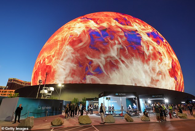 Tourists are seen in front of Sphere on September 29