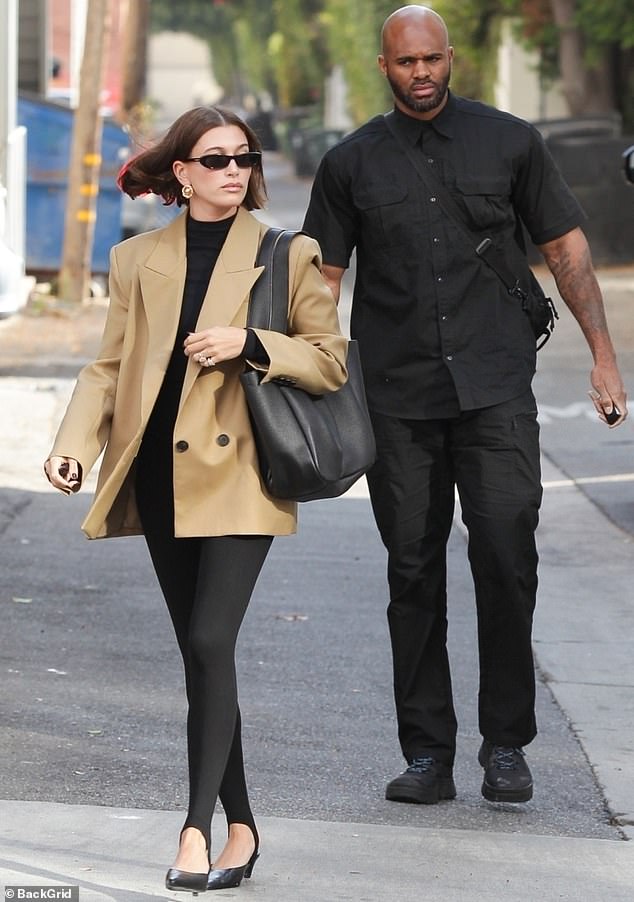 To recap, she accessorized the look with gold hoop earrings and narrow black shades, and rounded out the ensemble with a pair of kitten heels