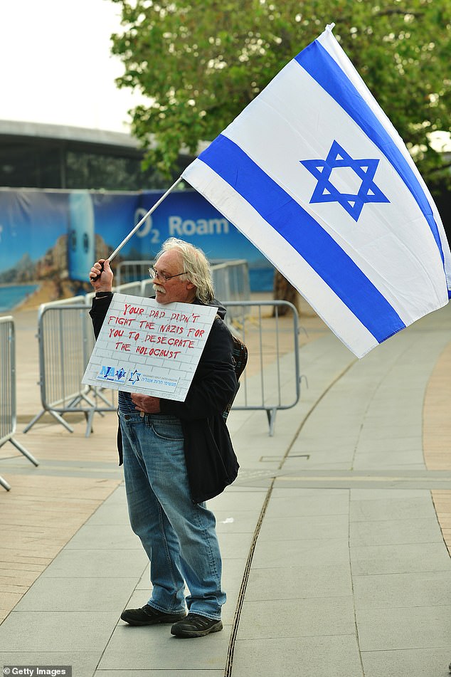 A protester outside the O2 Arena before Roger Waters' performance on June 6