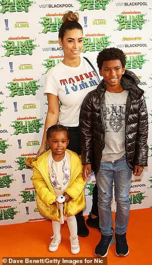 Reigan, who now scores for Man City's youth team, is photographed with his family at Blackpool Pleasure Beach in 2018