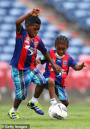 The brothers play together during their father's first Newcastle Jets training in 2012