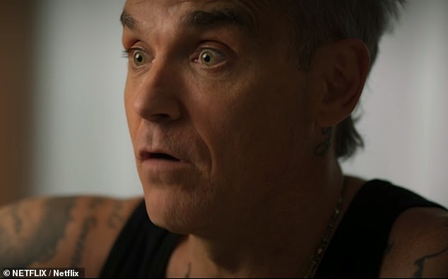 Raw: Robbie said: 'I was taking everything I could get my hands on – ecstasy, cocaine, drinking.  I literally drink like a bottle of vodka the night before I go to rehearsal, so that happens every night.”