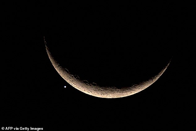 Here the crescent moon and Venus are depicted in Bangkok on March 24, 2023, after an occultation (Venus is obscured by the moon)