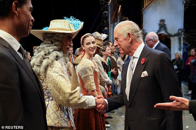 King Charles shook hands with the cast members who were dressed in their stage costumes