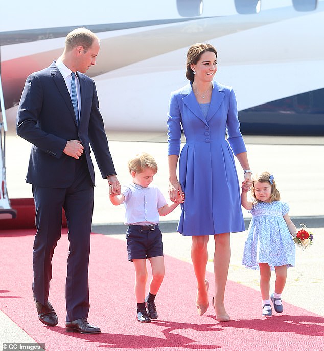 The Prince and Princess of Wales and their two eldest children in a stunning baby blue ensemble at Berlin Airport during an official visit to Poland and Germany in July 2017