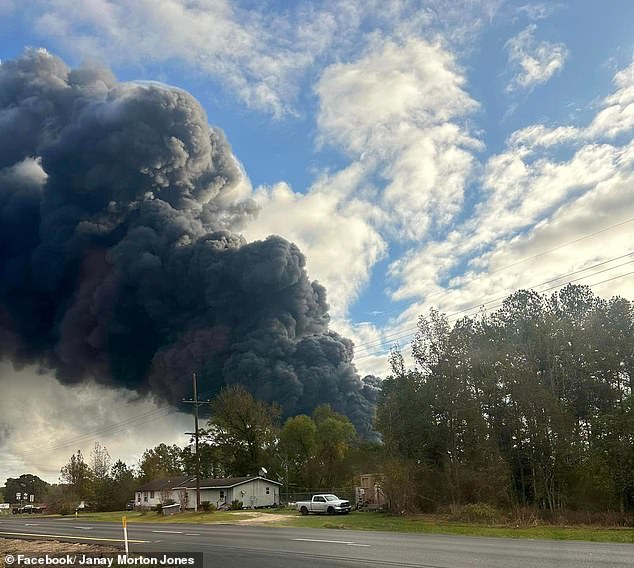 The dark smoke has taken over the bright blue sky from the chemical explosion (photo)