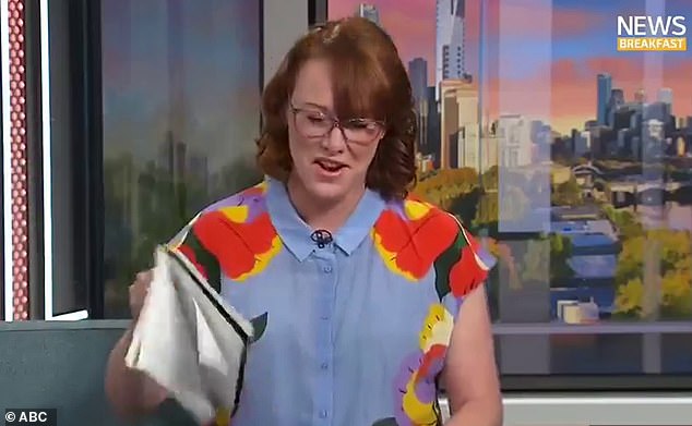 Imogen Crump (pictured) was reading the headlines on ABC's News Breakfast on Wednesday when she suddenly stopped due to a perimenopausal hot flash