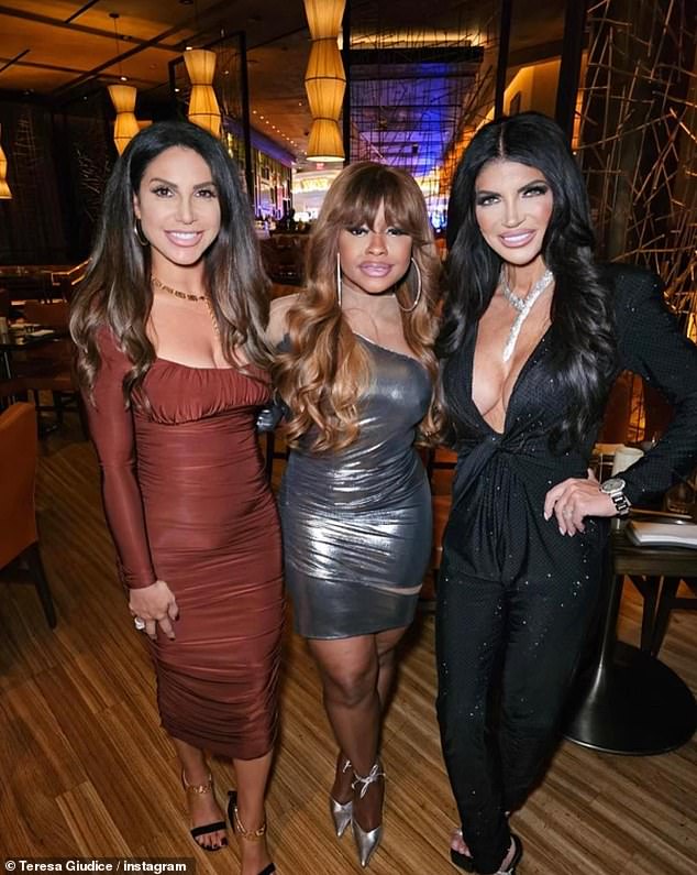 Big smile: The reality star flashed a cheerful smile as she paused for a photo with Jennifer Aydin and Phaedra Parks