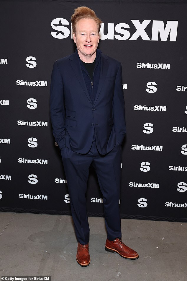 Sharp: Conan O'Brien was also at the event;  the late night show host looked dapper in a navy blue suit, with a black shirt and brown shoes