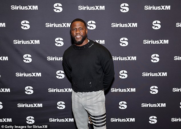 Looking good: Kevin Hart rocked gray and black pants, with a black sweater with stud accents