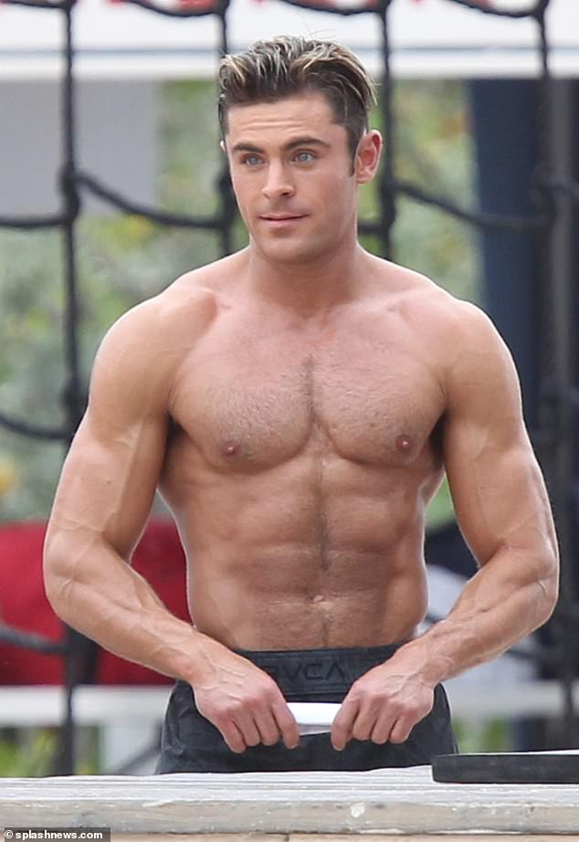 Zac Efron is pictured above during the filming of 2017's Baywatch, sporting his classic look