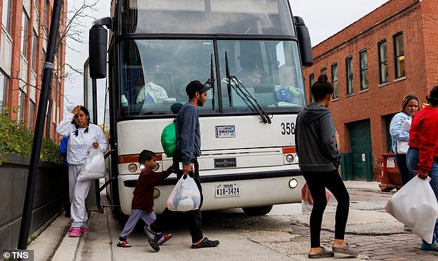 The crisis is also being felt further north in places like Chicago (pictured), where a group of migrants were pictured leaving a bus near a Greyhound station after being transported from Texas.