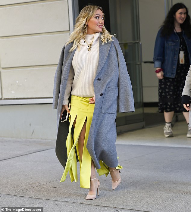 Chic: The Younger alum, 36, wore an ankle-length lemon yellow skirt that fell in long strips from the bottom of her derriere to the bottom of the skirt