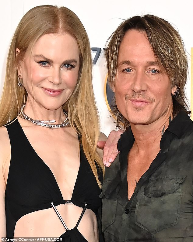 Not a wrinkle in sight: the fifty-somethings both looked very fresh as they posed together on the red carpet