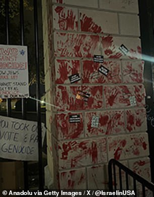 Blood-red handprints were taped to the side of the White House fence