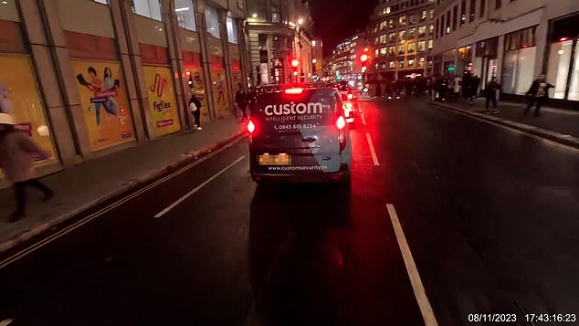 The cyclist approached the van driver several times after realizing he was on his phone