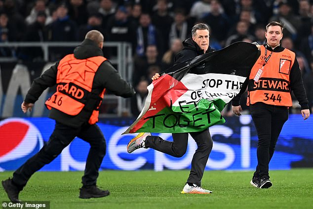 There was another pause in play when a fan ran onto the field carrying a Palestinian flag