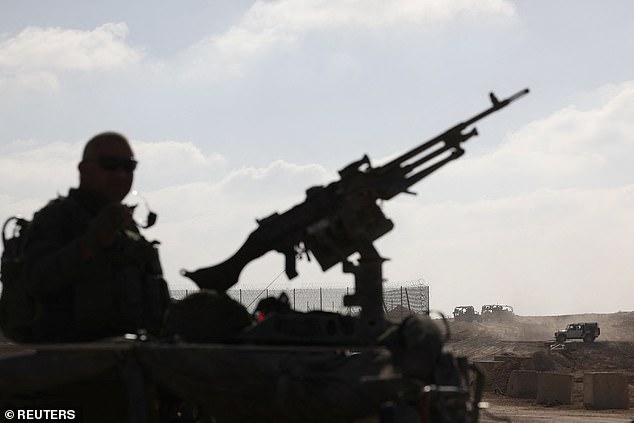 Israeli soldiers make their way towards the Israeli border with Gaza, amid the ongoing ground invasion against the Palestinian Islamist group Hamas, in southern Israel, November 8, 2023