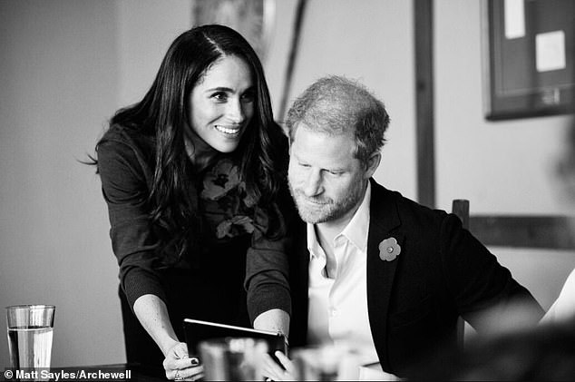 Meghan fittingly opted for a poppy cardigan for the outing