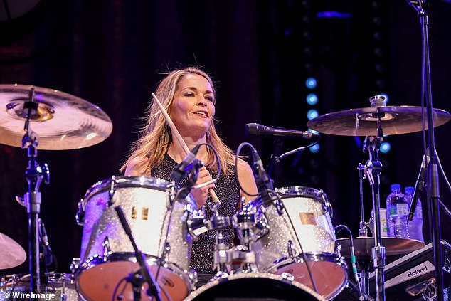 A stunner: percussionist Caroline dazzled in a glittering black top as she sat at the back of the stage behind her drum kit