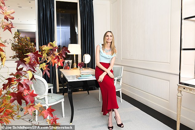 Spotless!  She paired her stylish look with black heels