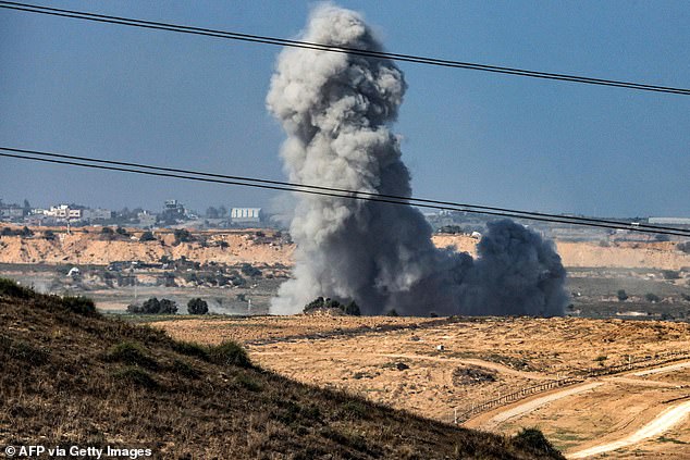 A plume of smoke erupts during Israeli bombardment near a position along the Gaza Strip border in southern Israel on November 8, 2023