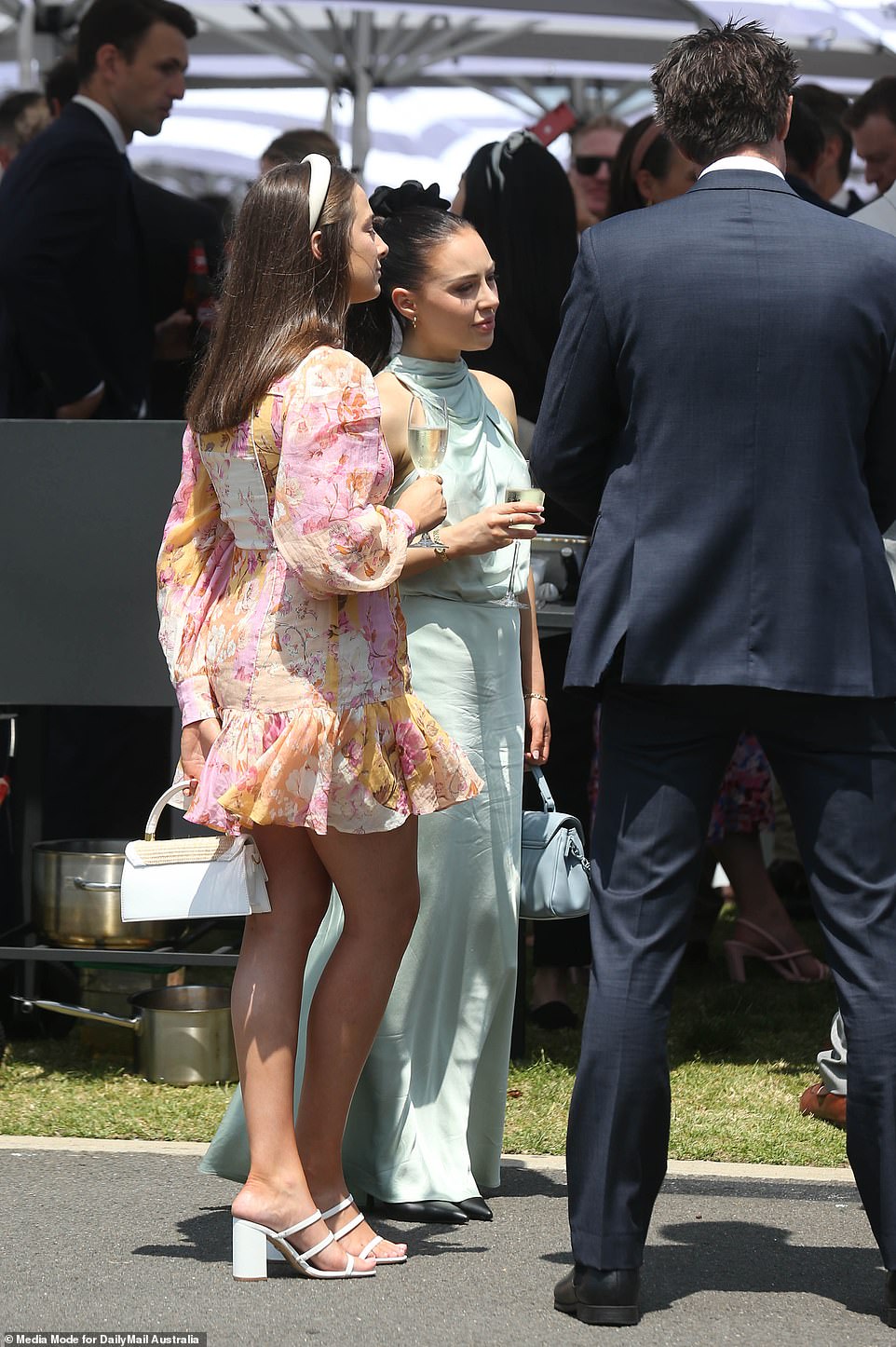 These two women appeared deep in thought during Ladies Day in Melbourne on Thursday