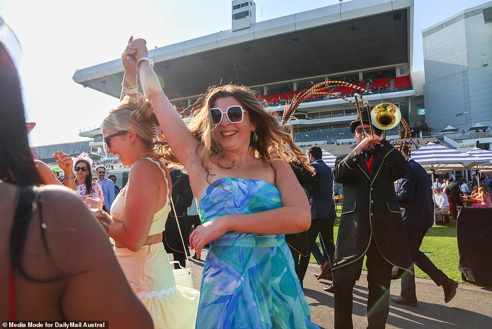 Jumping for joy!  These women enjoyed the live band during the races