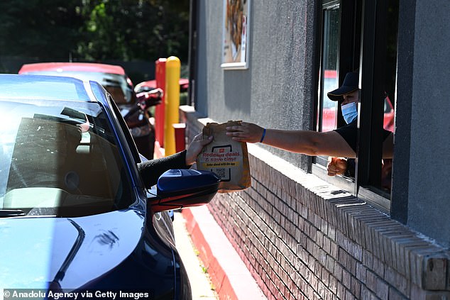 Millions of Californians say there just aren't enough good-paying jobs.  Pictured: a McDonald's drive-thru in Belmont