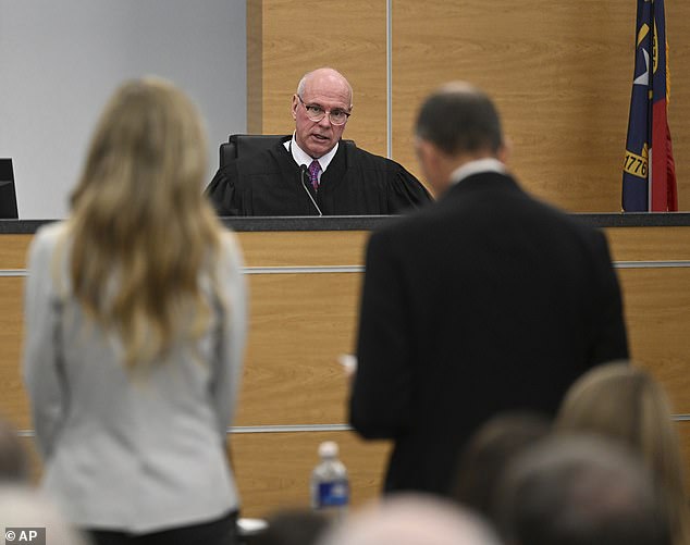 Supreme Court Justice David Hall addresses Molly Corbett (left) as she pleads no contest to voluntary manslaughter