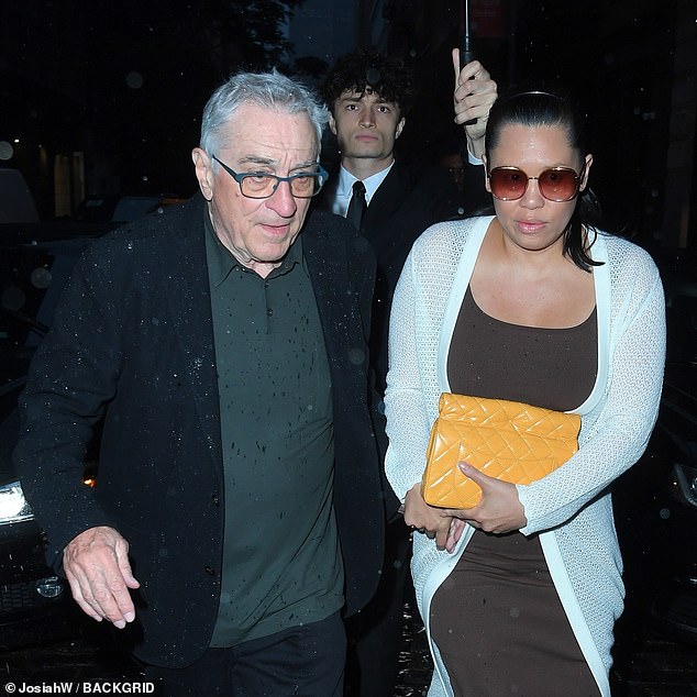 De Niro is pictured with his girlfriend Tiffany Chen in June.  Robinson and Chen got into an argument, with Chen expressing concerns about Robinson's spending