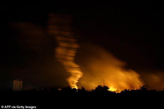 This photo, taken from the Israeli side of the Gaza Strip border, shows flares being fired by Israeli forces