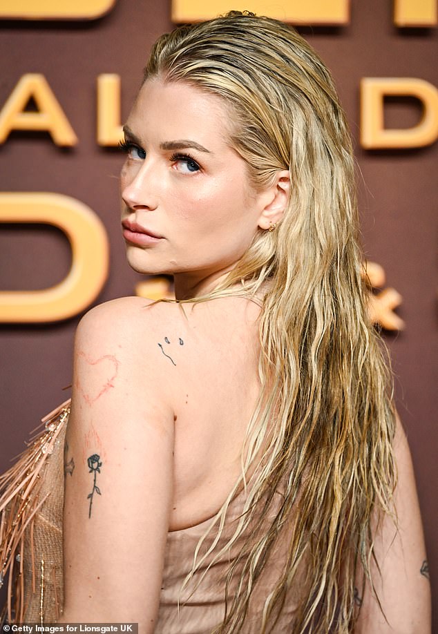 Beautiful: Kate Moss's little sister wore a nude-colored, sheer dress with tassels along the deep neckline