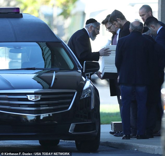 Samantha Woll's casket was loaded into a hearse after the funeral service at the Hebrew Memorial Chapel on October 22.