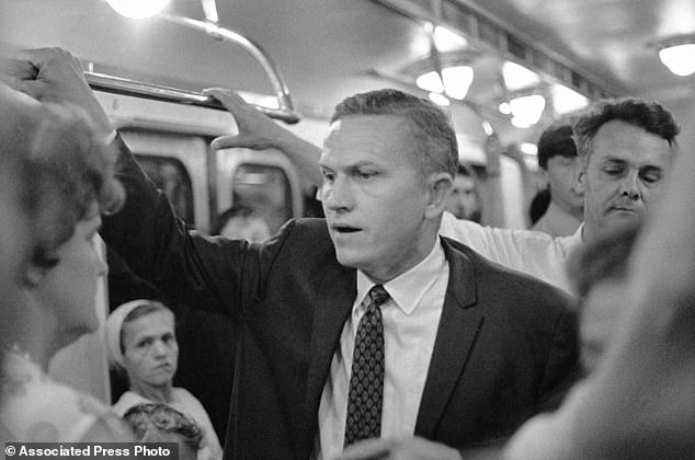 Frank Borman talks to people in the Moscow subway, Russia, July 9, 1969