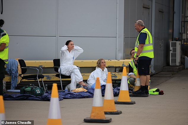 BA cabin crew donned hazmat suits after four passengers fell ill from unknown 'fumes' on a British Airways flight in October