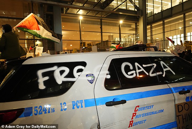 Outside the New York Times building, NYPD vehicles were spray-painted with “Free Gaza” written on the side