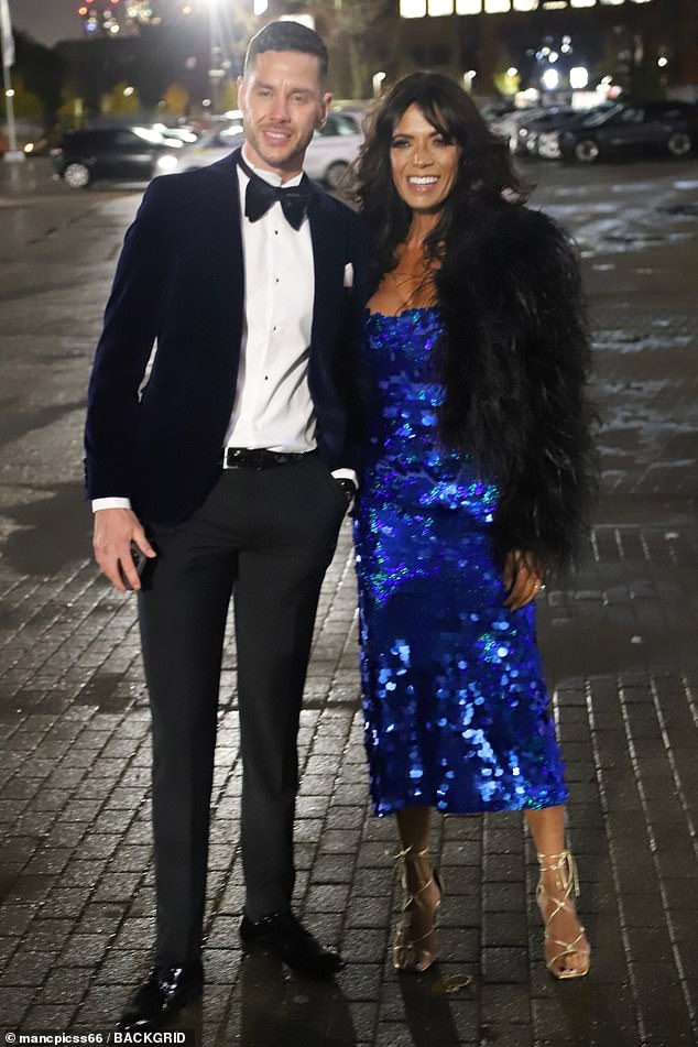 Unlikely pairing: Love Island's Scott Thomas looked dashing in a classic black tuxedo and white shirt alongside Jenny Powell, who wore a 55, who wore a stunning blue sequin dress