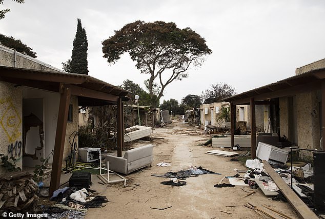 A street in kibbutz Kfar Aza is seen on October 27 and 20, days after Hamas stormed the area